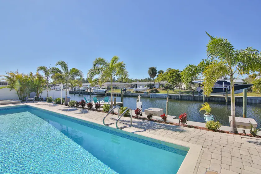 Coco's Dream - Waterfront Home w/ Oversized Private Heated Pool, 5 Min to AMI - Image 1