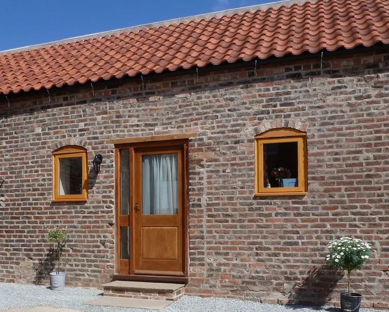 Barn conversion on small working farm - Image 1