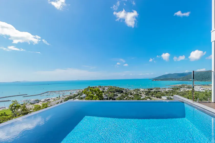 Relax in style as you overlook the Coral Sea and Whitsunday Islands beyond - Image 1