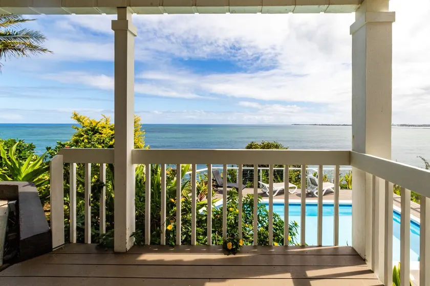 Oceanfront in Hilo Hale Kai Suites- Pele Suite - King Bed, Living Room, Bath - Image 1