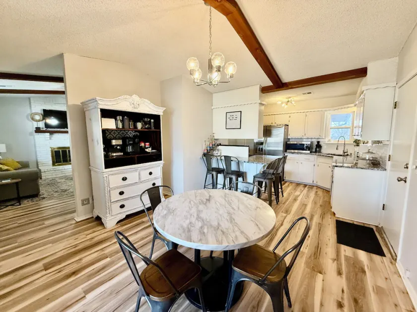 Charming 3BR retreat with a coffee lover's dream setup, fenced backyard, patio, and all the comforts of home. - Image 1