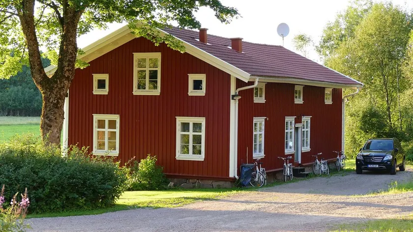 A typical swedish timber house- red with white corners - Image 1