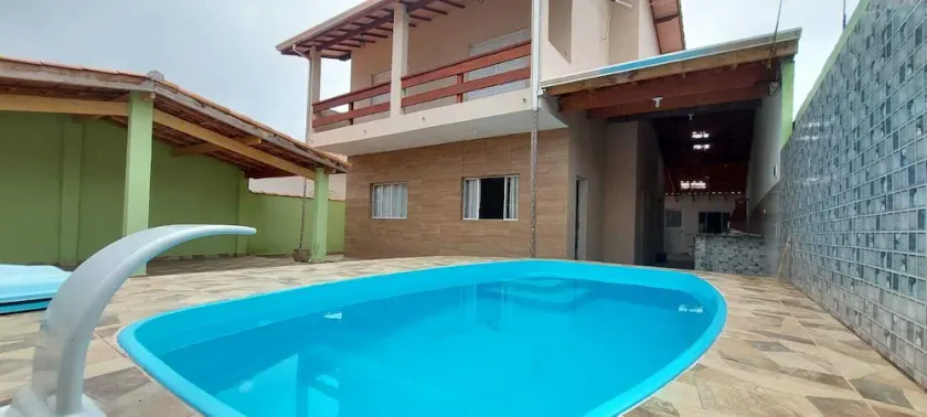 Two-story house with pool in gated community. - Image 1