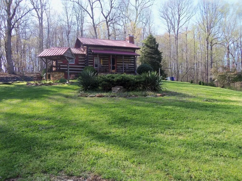 A authenic early American cabin located on a 85 acre farm in NC Foothills. - Image 1