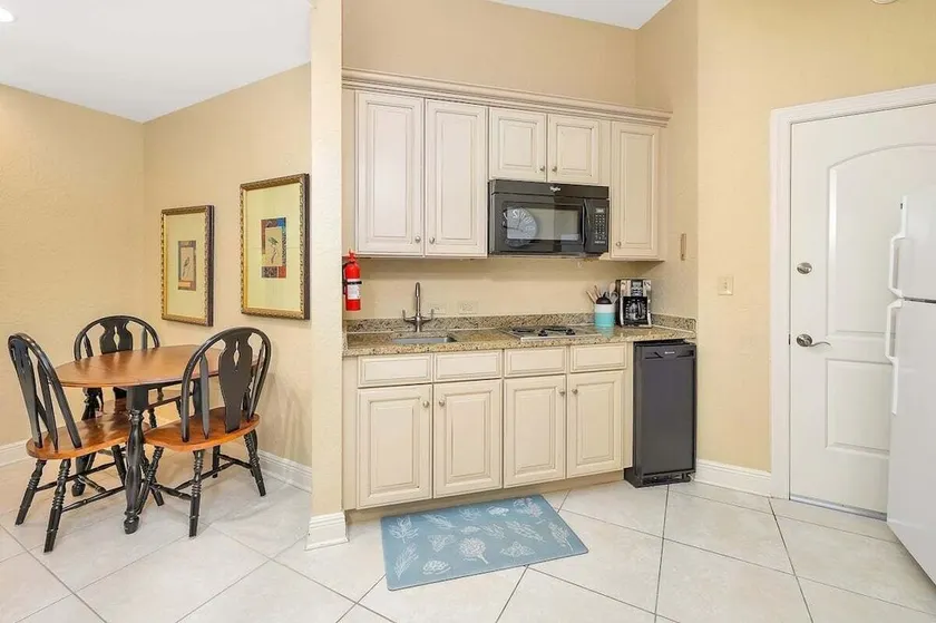 Enjoy this convenient located condo with pool! - Image 1
