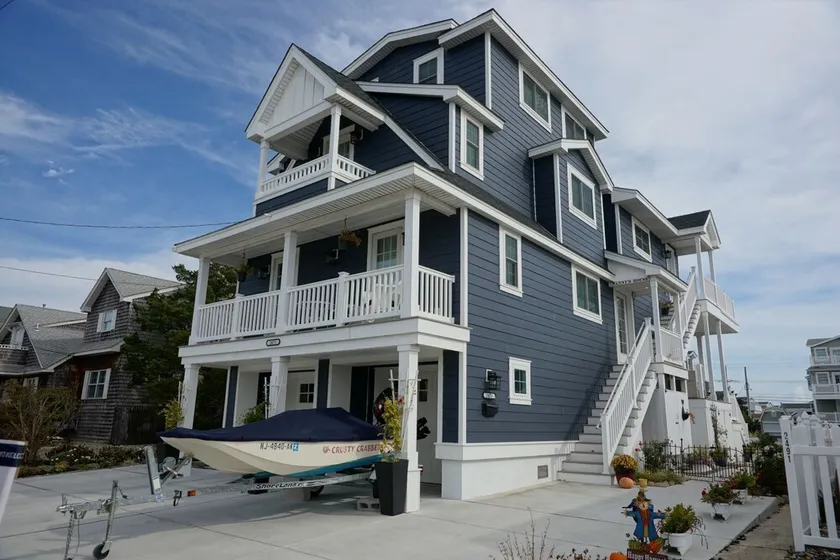 Enjoy water views from the deck overlooking the bay, or get close to the action on the bayfront dock. - Image 1
