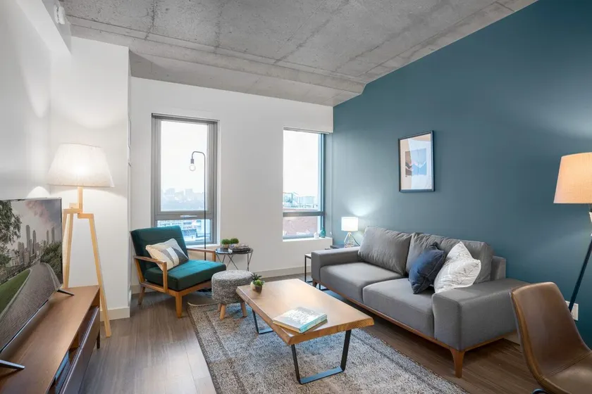 Industrial 1BR near MIT w/ Gym, Doorman, Roof Deck - Image 1