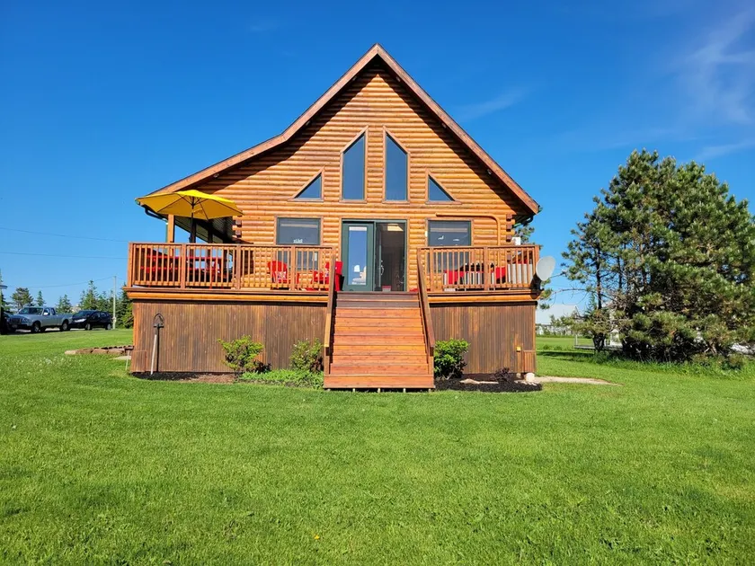 Water Front Log Cottage With Access To Outdoor Community Pool - Image 1