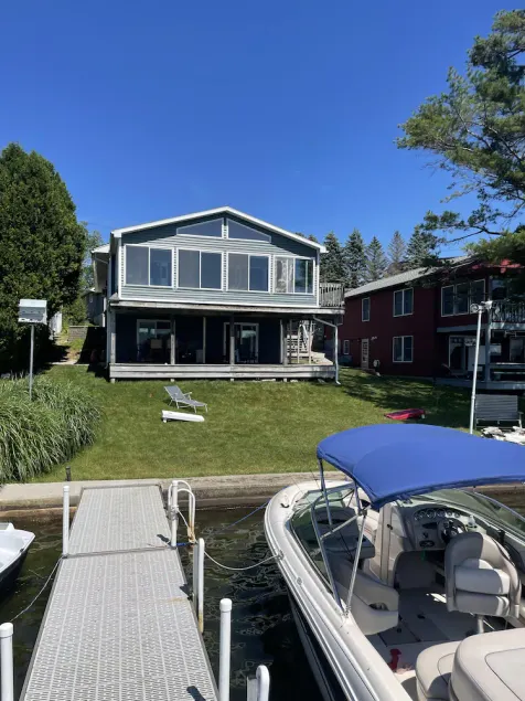 Beautiful Waterfront home with deep water dock on Onota Lake. Huge covered deck. - Image 1