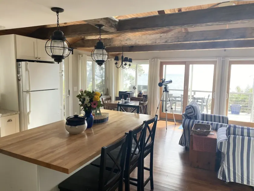 Take in the breathtaking views at our popular oceanside cottage with large deck. - Image 1