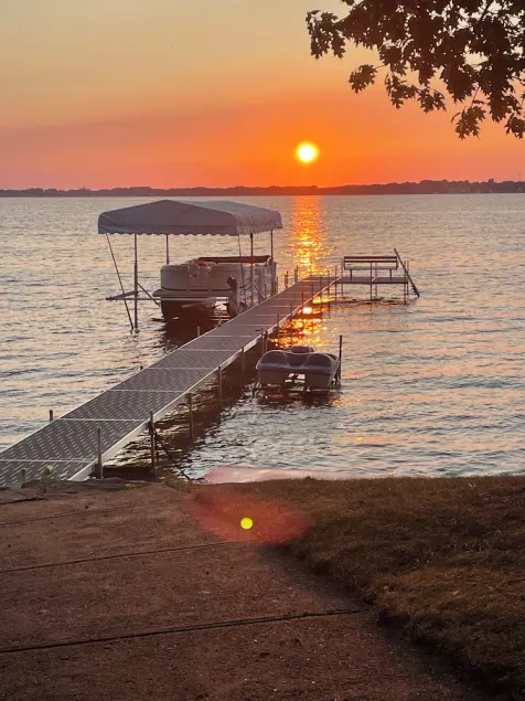 Enjoy this beach front lake home that boasts 66' of frontage with many amenities - Image 1