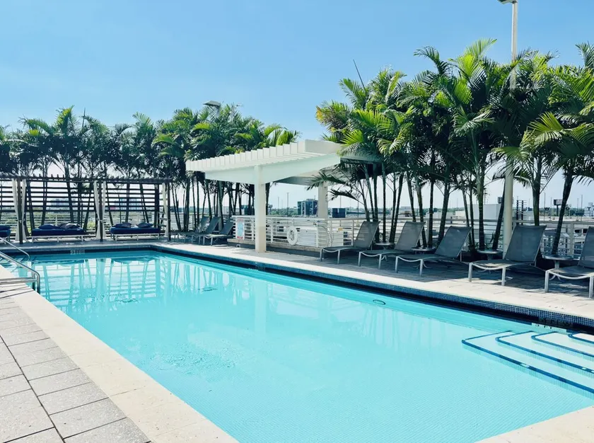 ☀ Sunset Views  • Pristine • Rooftop Pool & Lounge • Chic MIA • Parking Included - Image 1