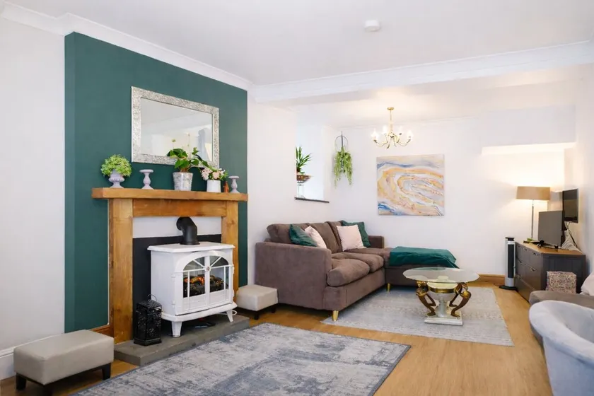 Discover Ty Hapus, a modern 3-bedroom townhouse perfect for 6 guests. Enjoy a private backyard . Located in a highly walkable neighborhood (score: 95) with vibrant culture, history, and excellent transit links to the Welsh coast, Cardiff and Swansea. - Image 1