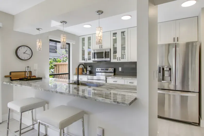 Serene Water-View Retreat with Wraparound Lanai & Elegant Renovations - Image 1