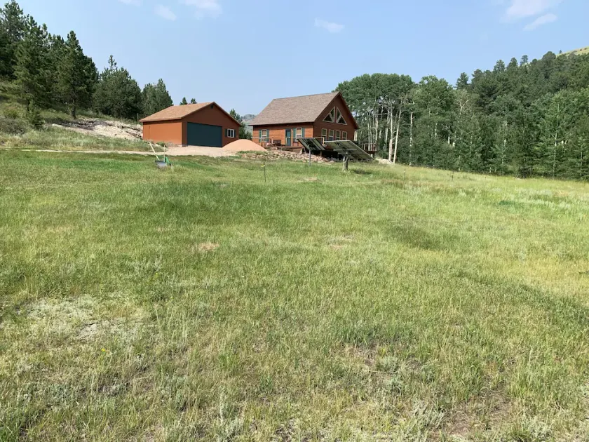 Remote off-grid cabin. Comfortable modern interior on 60 acres. - Image 1