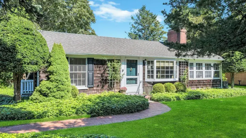 Beautiful cottage on meticulously maintained lawn, surrounded by... - Image 1