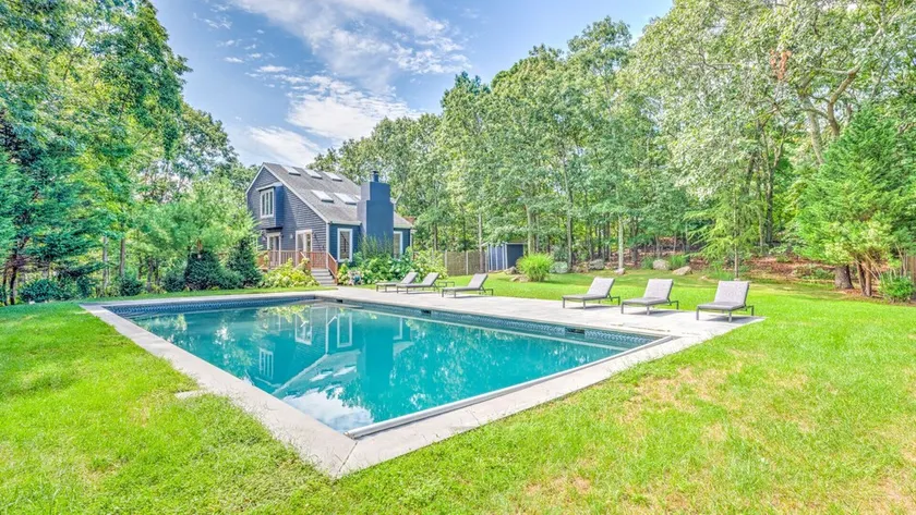 Head out East and live the good life in this renovated wooded oasis! - Image 1