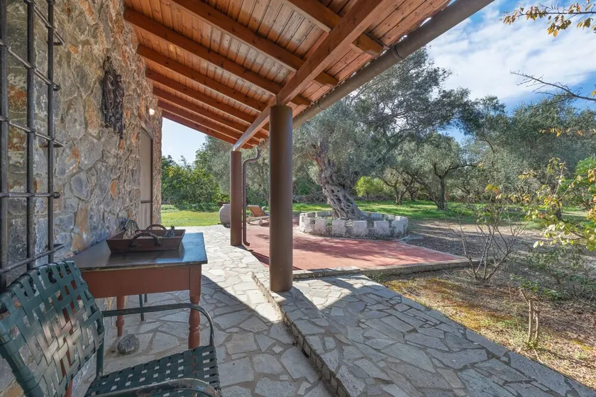 Stone house among trees - Image 1