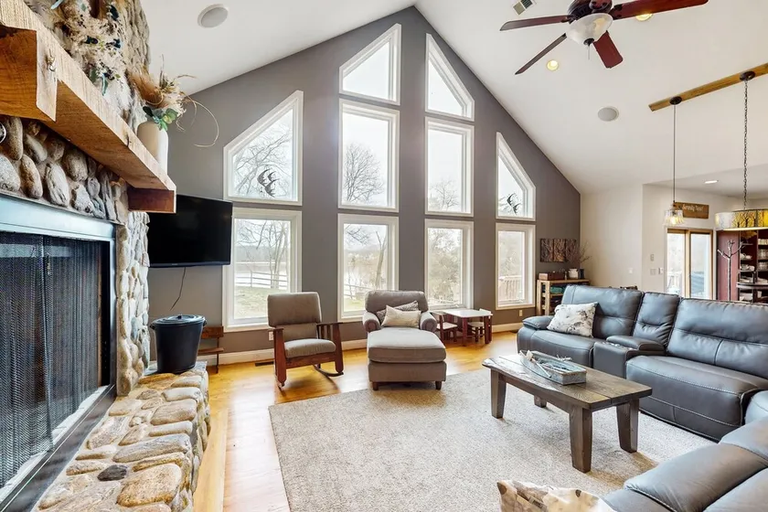 Nature lover's lakefront home with a beach, dock, fire ring, & more - Image 1
