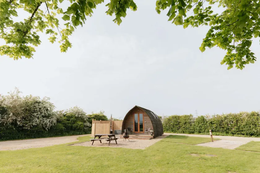 Cosy Glamping Cabin With Wood Fired Hot Tub - Image 1