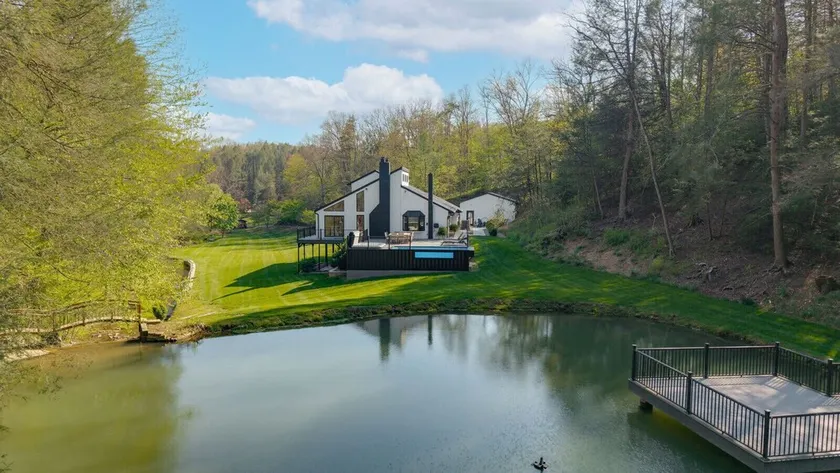 Experience the views from the hot tub or stargaze on the deck. Play games, relax around the fire pit, and make memories to last a lifetime! - Image 1