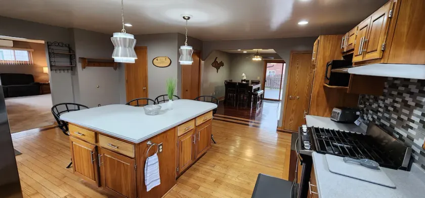 Cozy king bed suite, minutes away from ski resorts, snowmobile, and ATV trails. - Image 1