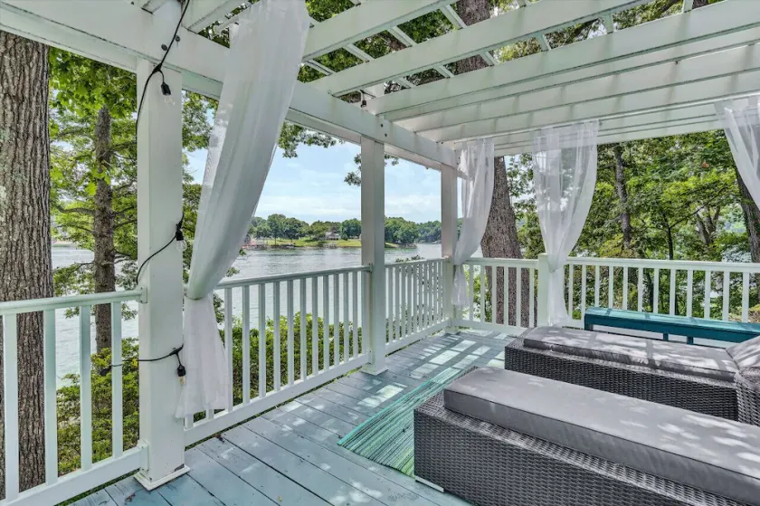 Grotto -Beautiful tiered yard with several seating areas and swing over looking the lake and Halesford Bridge - Image 1