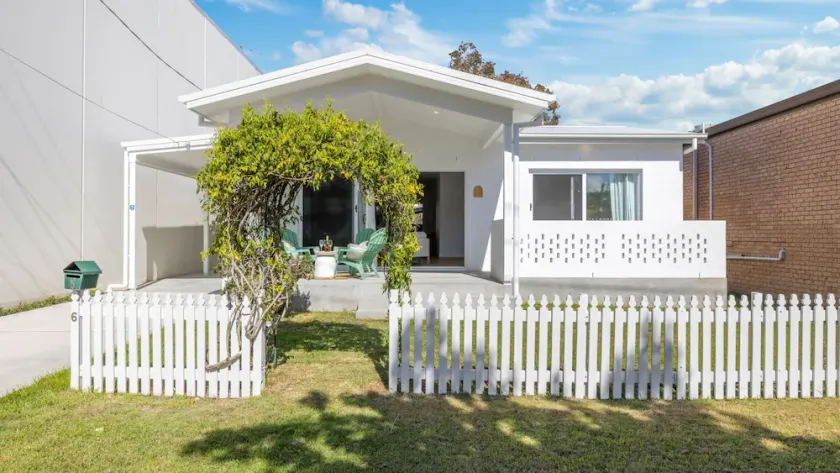 Experience the perfect blend of beachside charm and stylish holiday living - Image 1