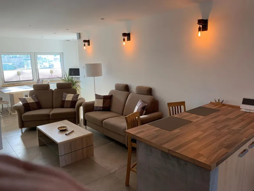 First floor vacation apartment on approx. 78 sqm, high-quality and modern furnishings with furnished terrace with garden pond and barbecue facilities, covered e-bike charging station and lockable bicycle room. You can look forward to: a fully equipped... - Image 1