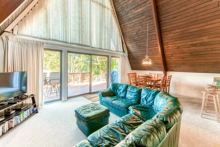 Charming, lakefront A-frame with private dock, lakeside gazebo, spacious deck - Image 1