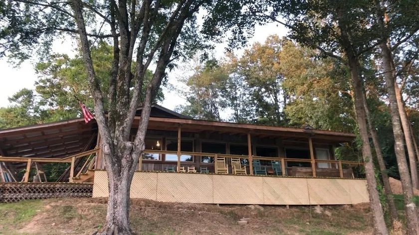 Cabin with 40 ft porch overlooking a pond.  - Image 1