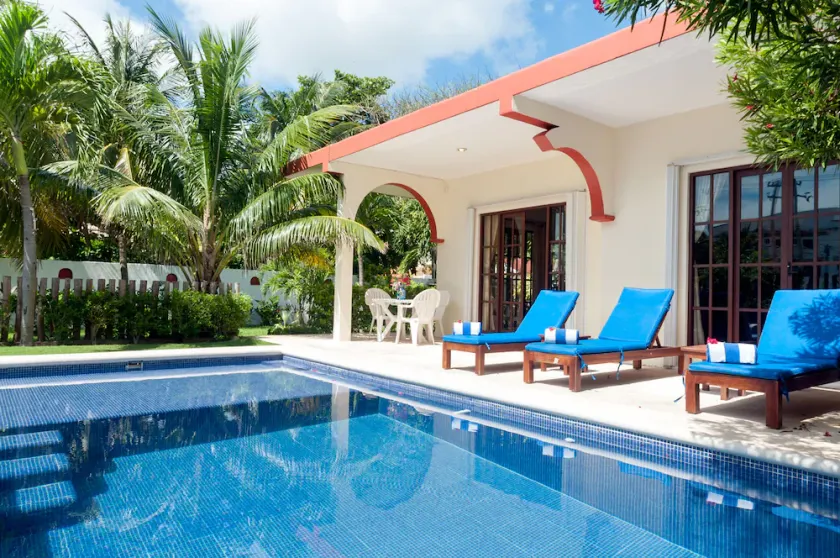 Relax by the sparkling pool and enjoy the ocean breeze. - Image 1
