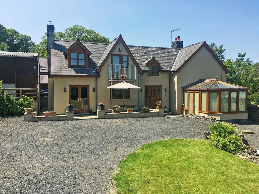 Large detached property with a patio, hot tub and enclosed garden. - Image 1