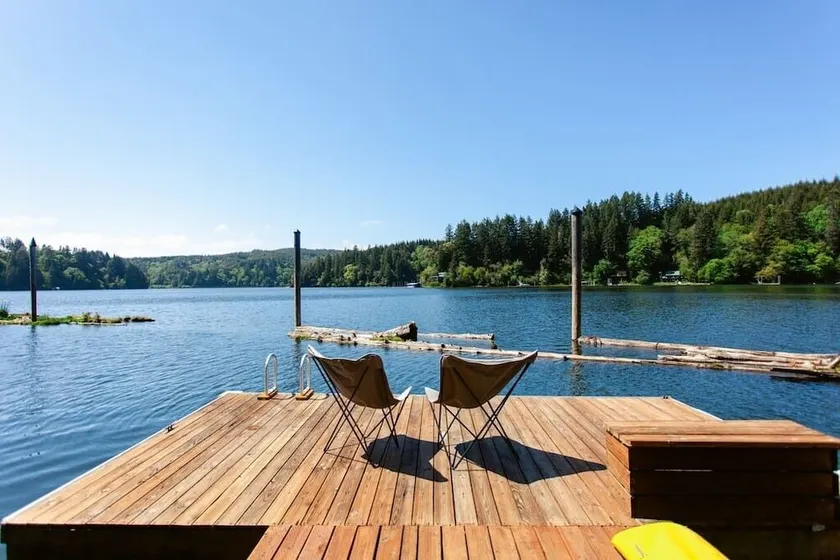 Secluded 1-bedroom lakefront cabin in Lakeside, OR. Ideal for writers or couples seeking solitude. Features a King bed, wood stove, kayak for 2, and stargazing from your private dock. - Image 1