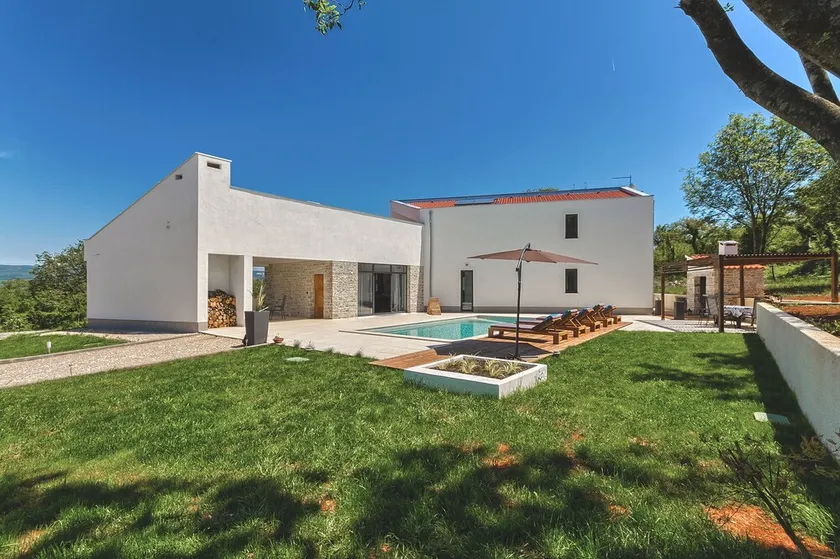 Modern peaceful villa with large pool in green surroundings offering privacy - Image 1