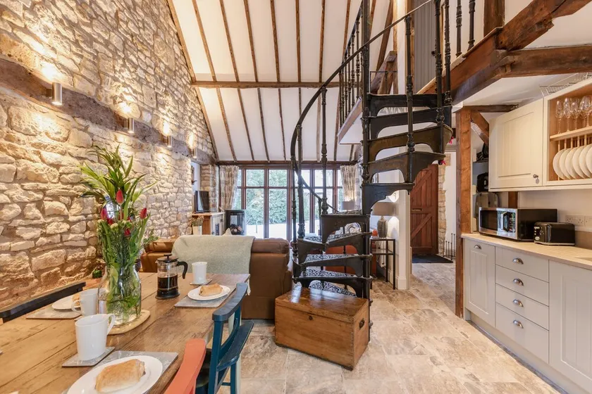 Stunning open plan 2 storey barn conversion with spiral staircase. - Image 1