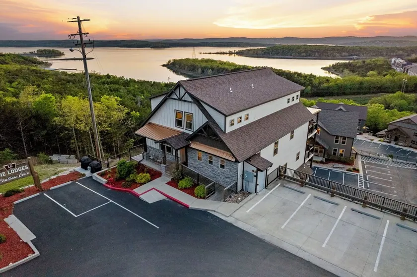 Top Lake View Retreat with 3 Decks, 2 Game Rooms, Theater, Free Tickets & Community Pool - Image 1