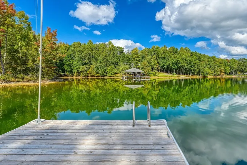 Stunning lakeside home with dock, large deck, firepit, & pool table - Image 1