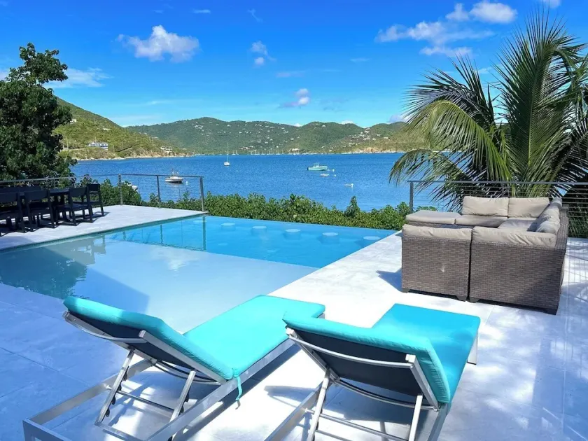 Discover the Rainbow Beach House – your ultimate beachfront getaway in stunning Coral Bay!  Experience the perfect blend of comfort and relaxation in this idyllic paradise. Book your escape today! - Image 1