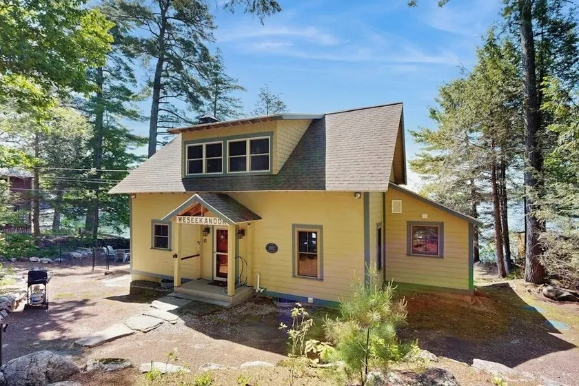 Captivating lakefront home with private dock, row boat, firepit, and lake views - Image 1