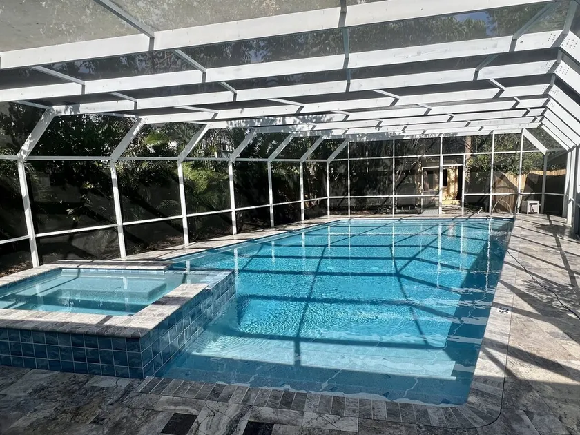 7 minute walk to Siesta Key beach.  Large heated pool/spa. Very private.1/2 acre - Image 1