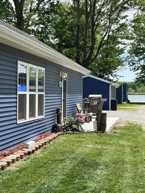 Large family cottage steps from waters edge. - Image 1