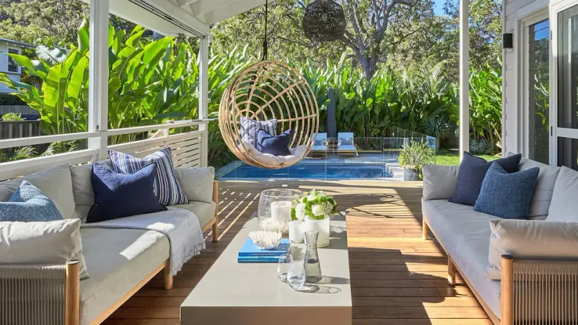 This home matches quaint beachside charm with luxurious comfort. - Image 1