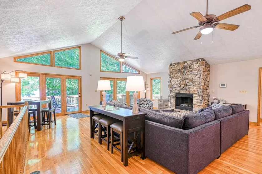 Lakefront home with deck, hot tub, game room, kayaks, & fireplace - Image 1