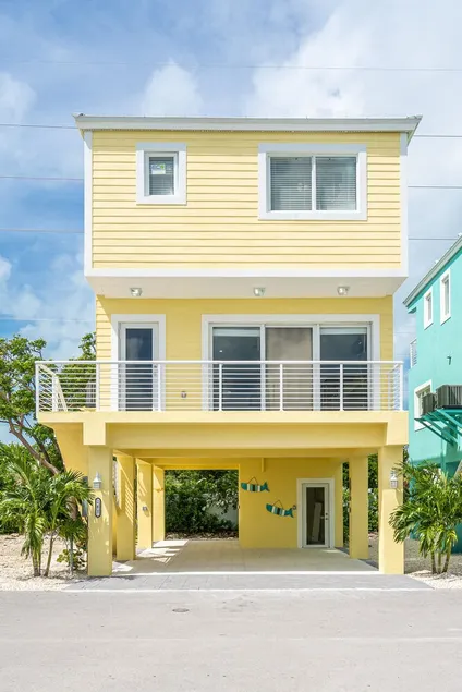 Yellow 3 Story Home - Image 1