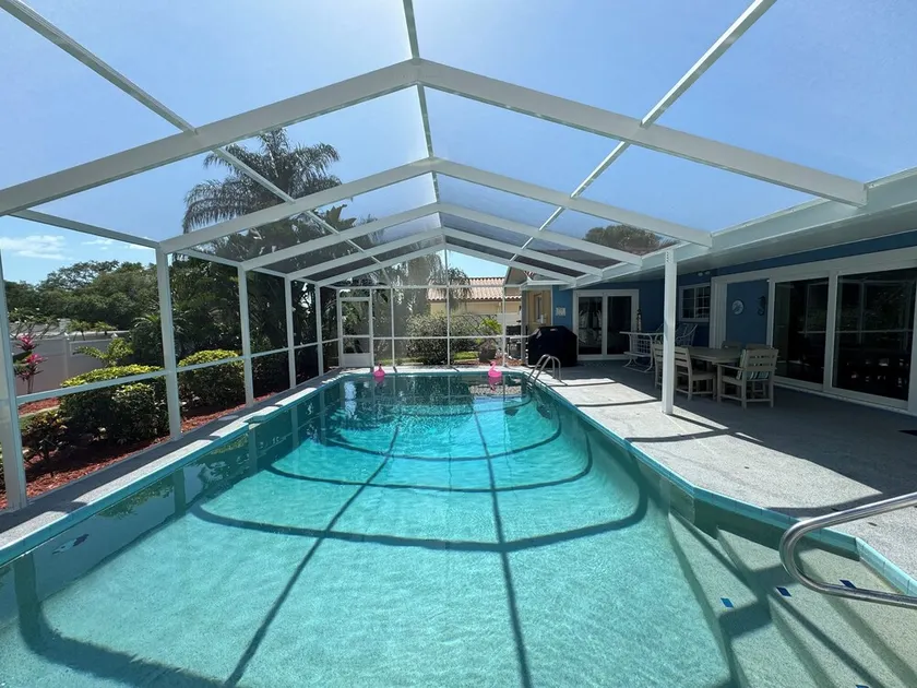 Little bit of heaven, 3BR 2BA heated pool, gorgeous yard & <10 min to the beach! - Image 1