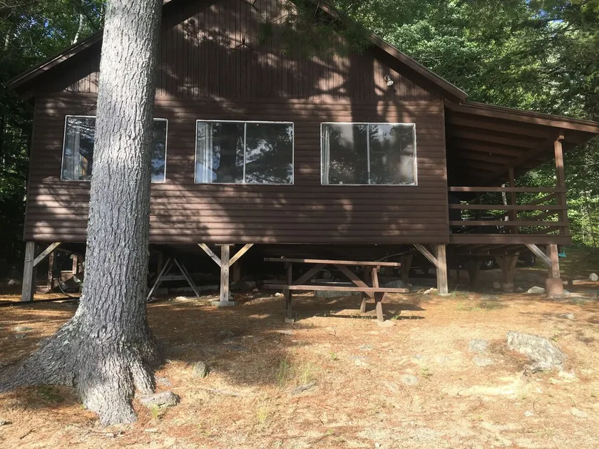 Beachfront Cottage on Ambajejus Lake With Sandy Beach and a Mountain View - Image 1