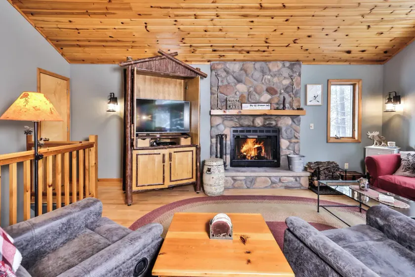 Lakefront home on Big Saint Germain Lake with dock, enclosed porch, and fire pit - Image 1