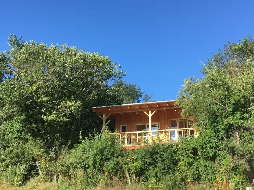 Cozy wooden cabin with a covered terrace and a panoramic view - Image 1