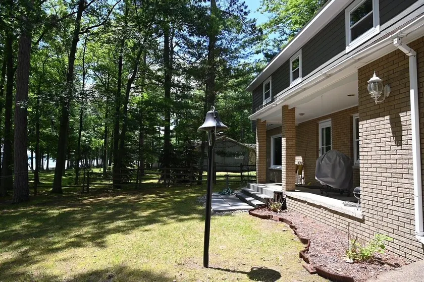 Spacious vacation home on large private wooded lot on crystal clear Hubbard Lake - Image 1